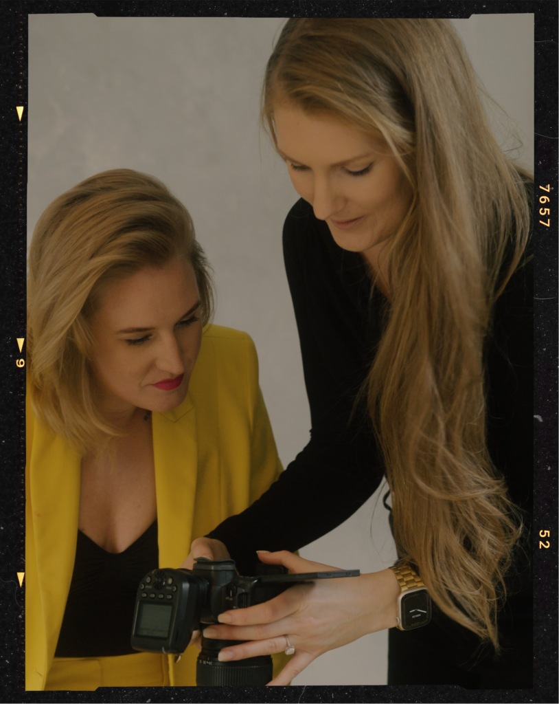 photographer guiding client how to pose for a photoshoot